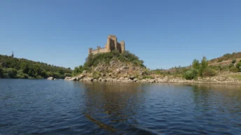 almourol tagus river tamplar castle tiny island water blue boat {{brizy_dc_image_alt imageSrc=